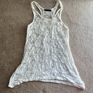 Cream/off white lace racer back tank top with pocket in front and longer sides